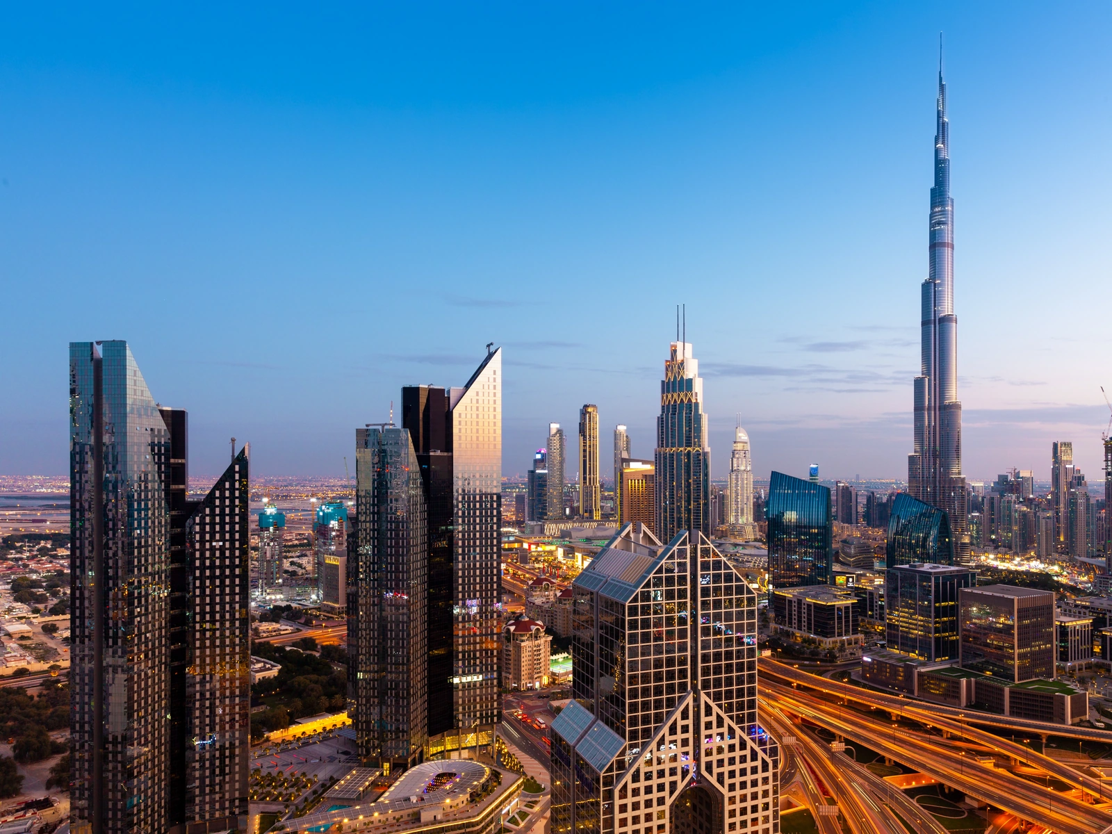 Dubai skyline at sunset with Burj Khalifa — UAE residency visa guide
